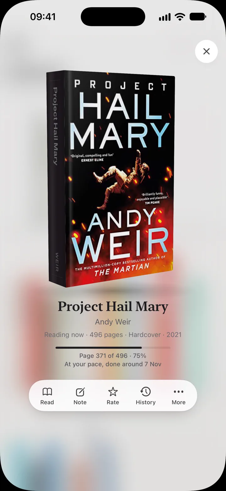 A book lifted off the shelf in 3D, with reading progress and actions to read, note, rate and see its history.
